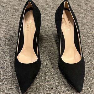 Mavette black suede pointy toe pumps.